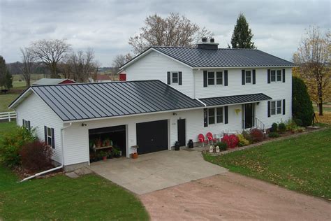 charcoal grey metal roof on white house|gray metal roofing.